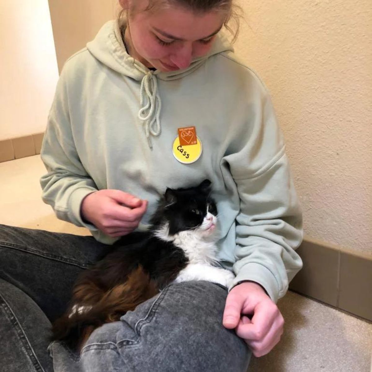 woman and a cat snuggling