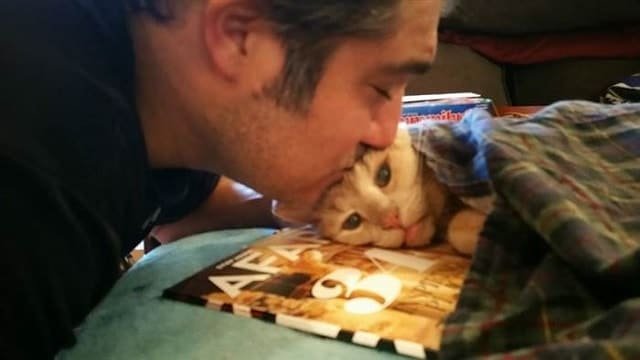 Tigger&rsquo;s dad, Michael Trentadue, gives him a kiss.