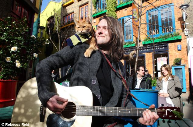 James Bowen's book about stray cat Bob (pictured together) who he adopted has sold more than 250,000 copies and is being considered for film by the same agent who brokered Marley & Me