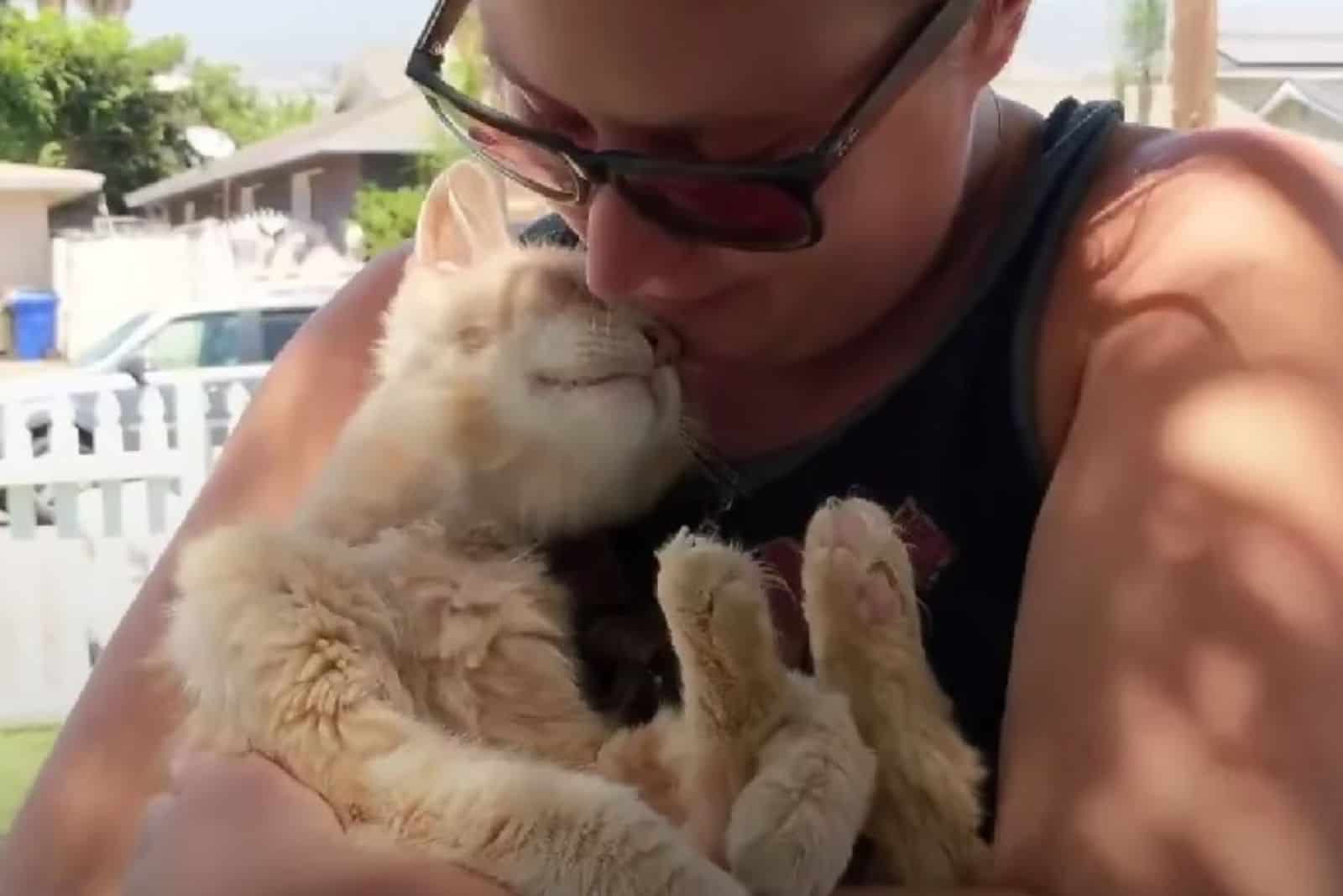 cat cuddling with owner