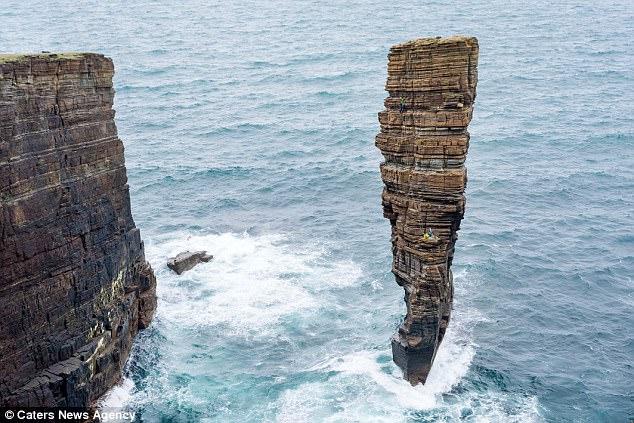 Fearless Clımbers Conquer Perılous Rock Formatıons Above Unreachable Ocean Waters