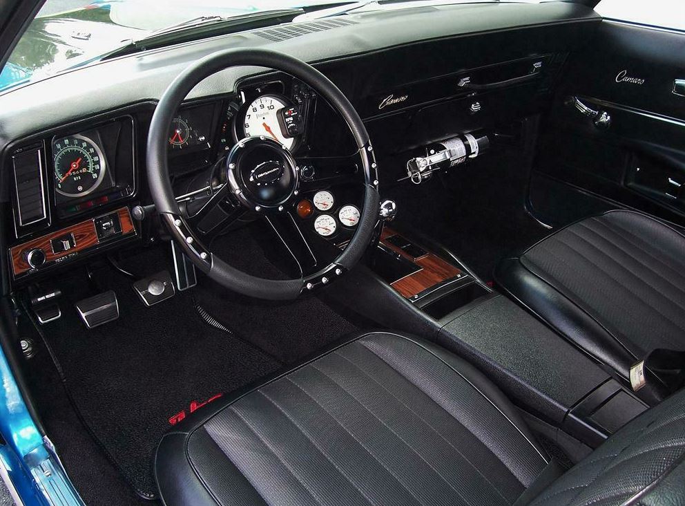 The car features vinyl bucket seats, which provide excellent support during spirited driving, and a full-length center console that houses the shifter and gauges.