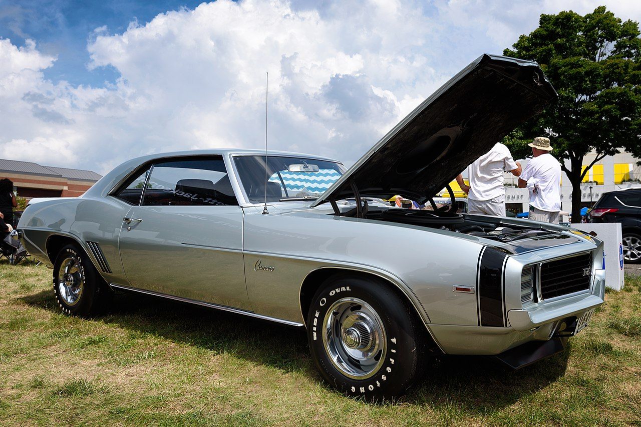 A silver 1969 Chevrolet Camaro ZL1with an open hood