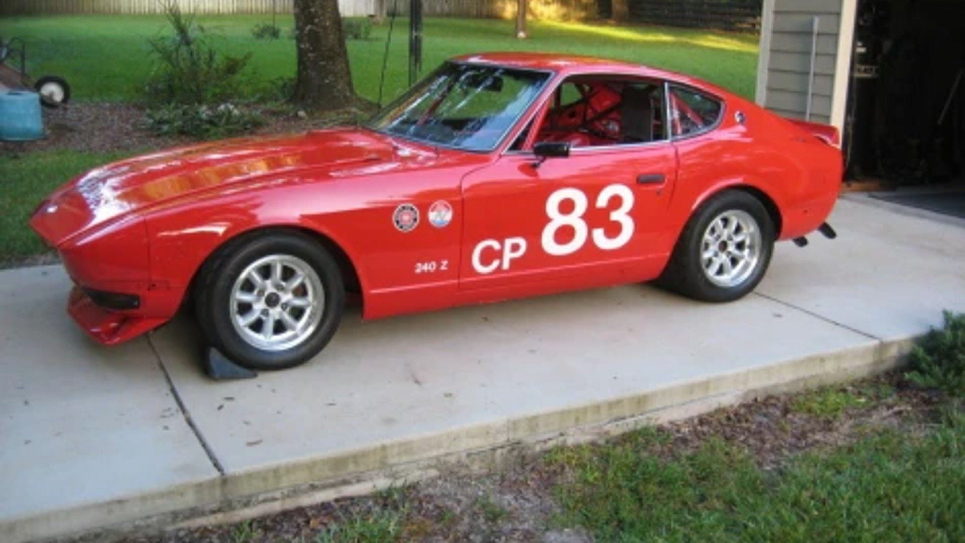 Side profile shot of a Nissan Fairlady Z race car.