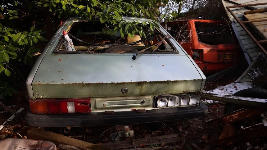 Classic cars abandoned in the woods