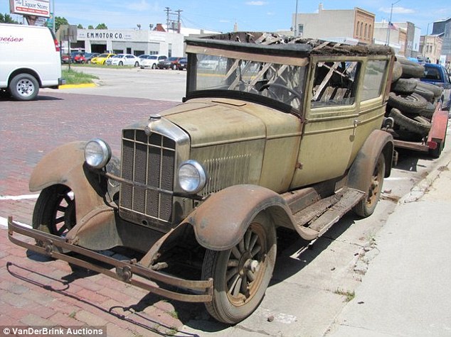 Rusted and Ruined: Despite the rarity of cars with almost zero on the odometer - the majority of the vehicles in the auction are trade-ins left to rot like this old fashioned car