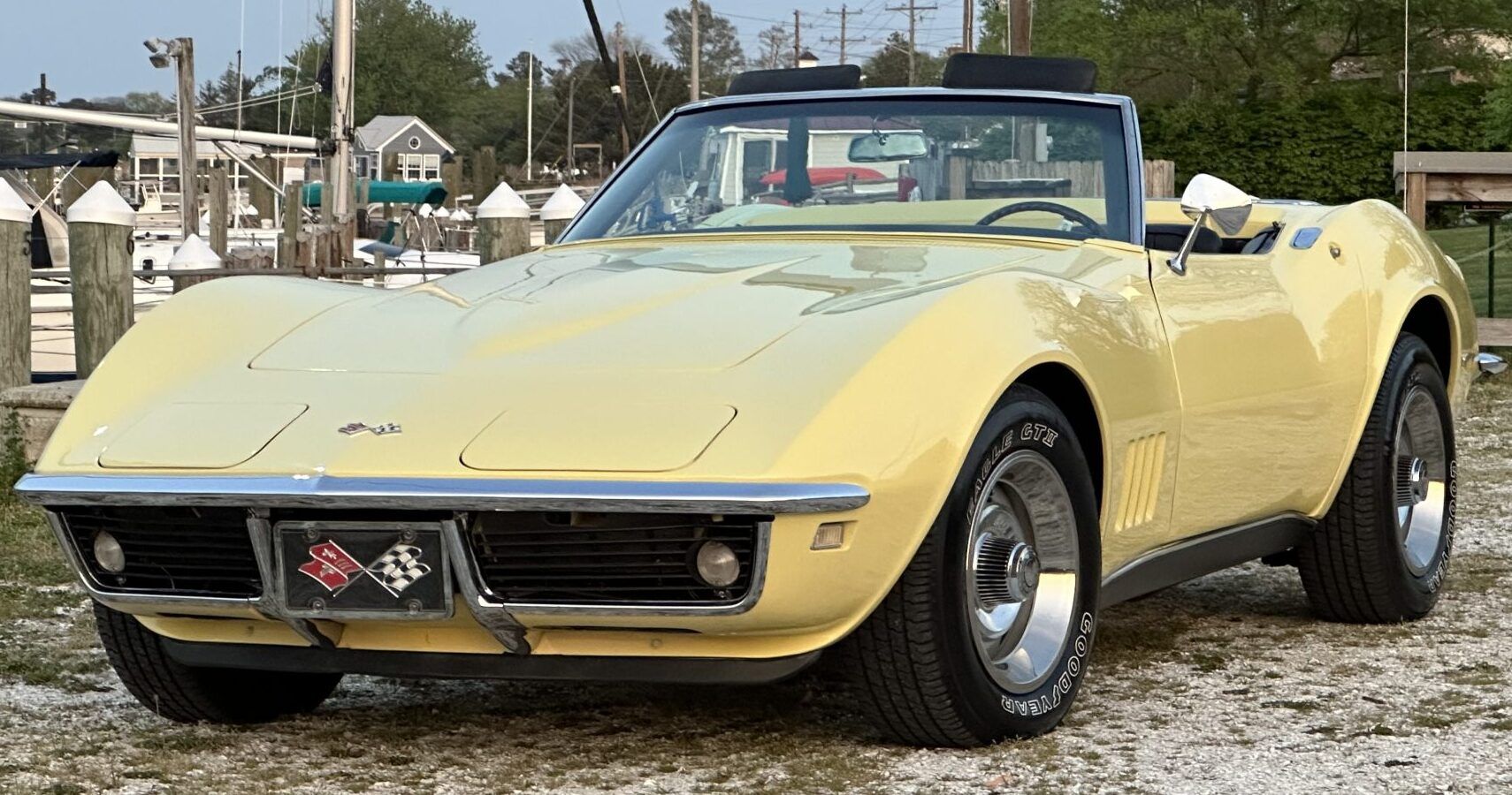 A yellow 1968 Corvette Stingray parked